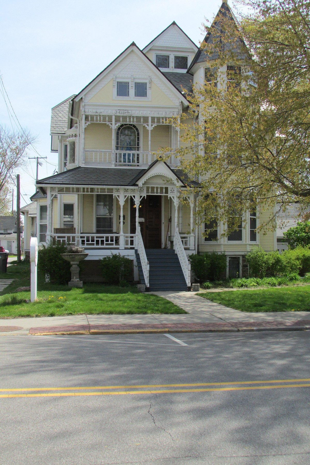 Detached residential home with a front path